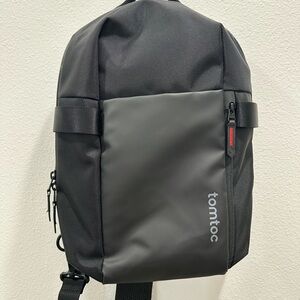 Tomtoc Men's Black Sling Backpack messenger laptop sleeve Compact shoulder bag